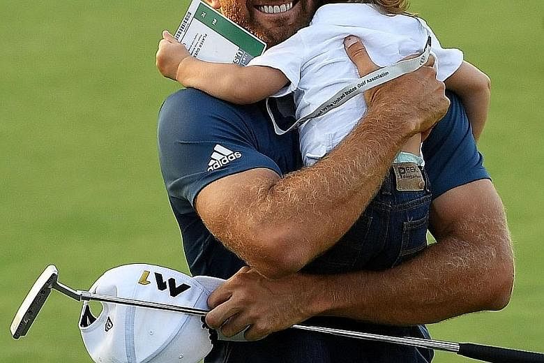 Dustin Johnson celebrating with his son Tatum after winning the US Open at the Oakmont Country Club. The win marks his first Major win after a few near-misses, allowing the American to take himself out of contention for the unceremonious title of "be