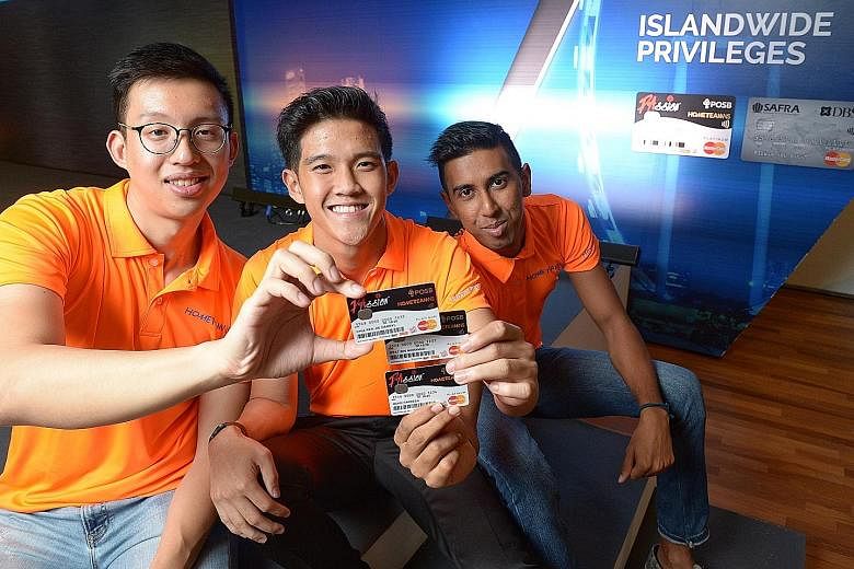 From left: Lance Cpl Chia; Sergeant Iffat Mohamad Rafi, 19, a staff assistant at the Police National Service Department; and Lance Cpl Muhd Fardeen, 23, a firefighter at Sentosa Fire Station, with their newly acquired HomeTeamNS- PAssion-POSB debit c
