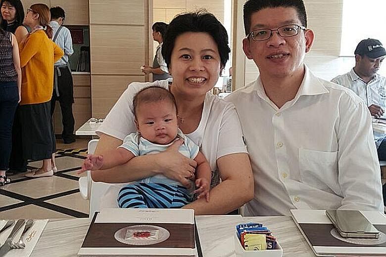 Ms Felicia Tan with husband Low Lieneng and their precious bundle of joy, Titus.