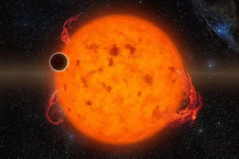 A Nasa handout showing K2-33b, one of the youngest exoplanets detected to date. It makes a complete orbit around its star in about five days. It is very hot, being 20 times closer to its sun than Earth is to ours.