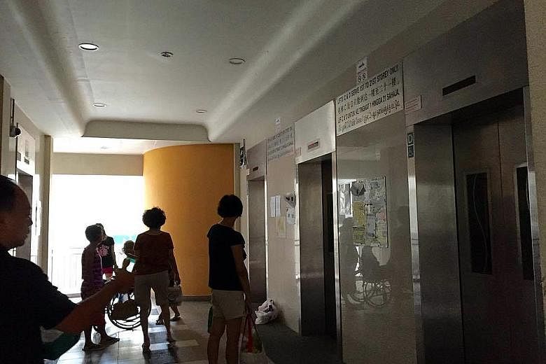 Residents stranded at the lobby of Block 28B Dover Crescent during lunchtime yesterday after the lifts lost power. Some climbed the stairs to their homes. Ms Thia, a resident, said she had noticed the two lifts serving the first and 22nd to 40th floo