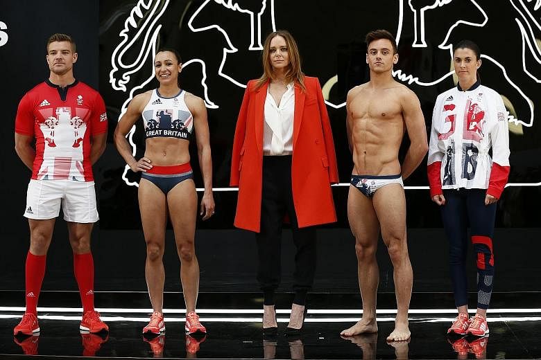 The designs for the British team for this year's Olympics in Rio by Stella McCartney (centre), in collaboration with sports brand Adidas. With her are (from left) rugby captain Tom Mitchell, track-and-field athlete Jessica Ennis-Hill, diver Tom Daley
