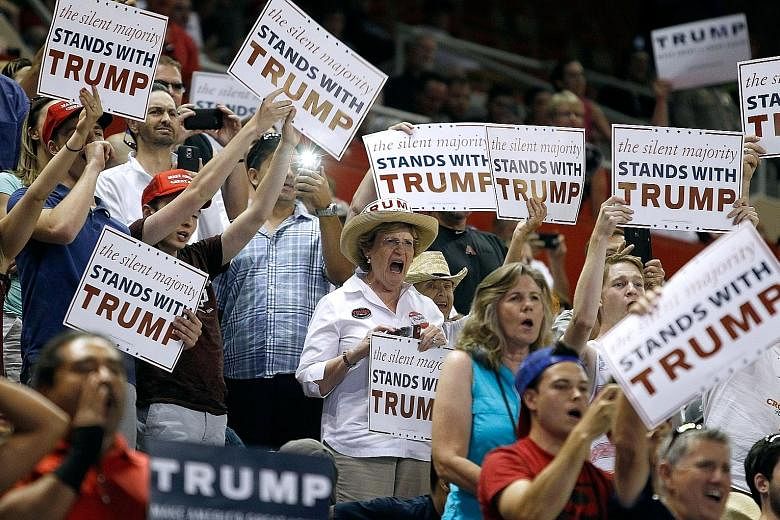 Supporters of Mr Trump cheering as he arrived at a campaign rally in Phoenix, Arizona, last weekend. Mr Trump's campaign finished May with little more than US$1 million in the bank. However, he says he is just getting started as a competitor against 