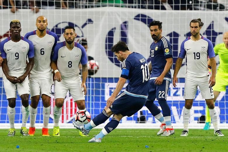 Above: Lionel Messi striking the free kick that doubled his side's lead against the US, setting them on the way to a 4-0 rout. 