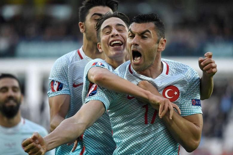 Turkey forward Burak Yilmaz (front) won the Man of the Match award with a tireless display and a goal in their 2-0 win over the Czech Republic. 