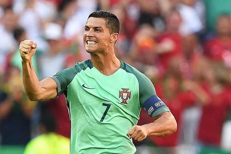 Portugal's Cristiano Ronaldo celebrating one of his two goals against Hungary on Wednesday. The brace took his tally of goals in the European Championship to eight, one shy of Michel Platini's record of nine.