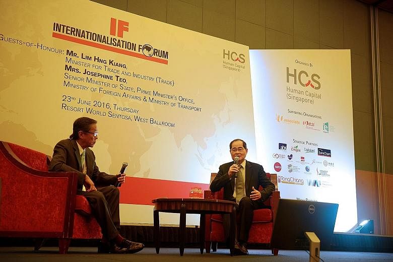Trade Minister Mr Lim with Banyan Tree Holdings executive chairman Ho Kwon Ping at the HCS forum yesterday.