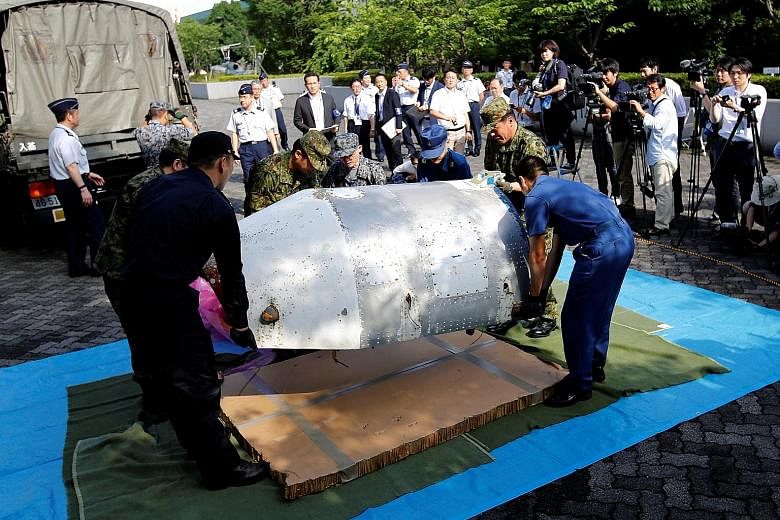 Japan has recovered half of a rocket nose cone (above) suspected to be from a rocket launched by North Korea in February. The 75kg part washed up on a beach in western Japan last Thursday.