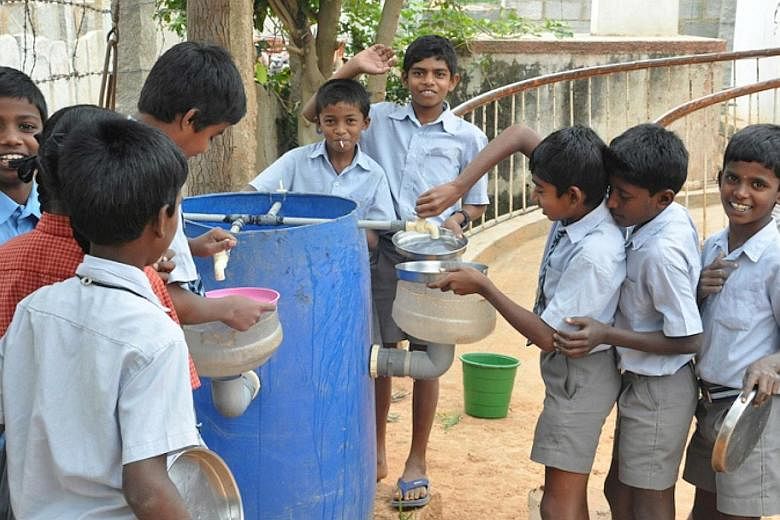 Children at the Muthur government school in India with a Reap Benefit low-cost device designed to re-use grey water so as to address the problem of water shortages. Reap Benefit gets schoolchildren to initiate innovative, actionable solutions to Indi
