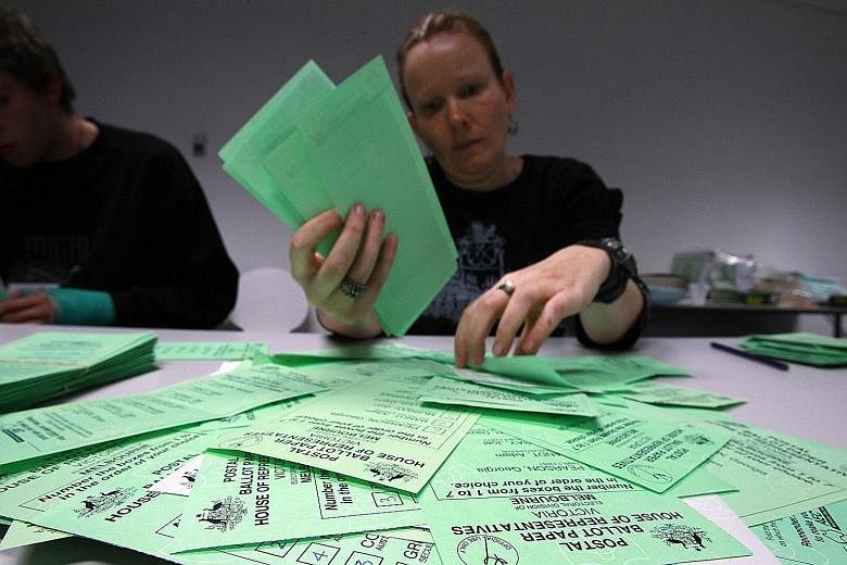 Ballot papers at an Australian Electoral Commission office in 2010. New rules put in place by the ruling coalition will try to prevent smaller parties from winning seats by swopping their unused votes with other parties.