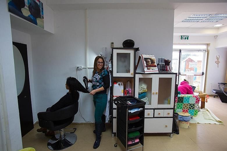 A client at one of the four branches of Women's Courtyard in Israel. These spaces attract a range of visitors, some suffering from terrible abuse or other problems, others with no one at home to talk to.