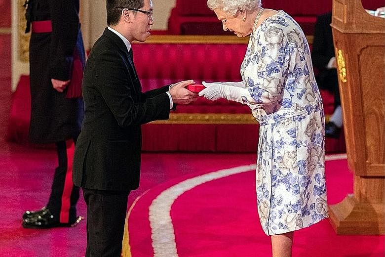 Mr Mark Cheng receiving his award from the queen at Buckingham Palace on Thursday. He is one of 60 young people from 45 Commonwealth countries honoured for transforming the lives of others and making a lasting impact on their communities.