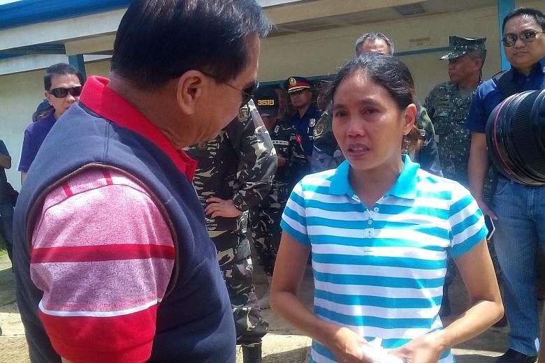 Ms Flor in Jolo, Sulu province, yesterday after her release on Thursday. She was abducted last year from an island resort in Davao province along with three foreigners. Two of them have been executed.