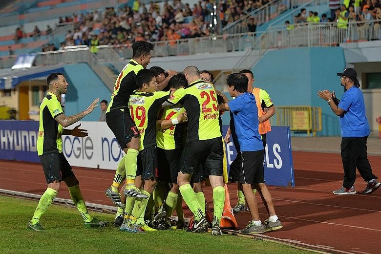 Tampines players celebrating Fazrul Nawaz's 80th-minute goal in the 1-0 win, which revived their chances with a third of the season left.