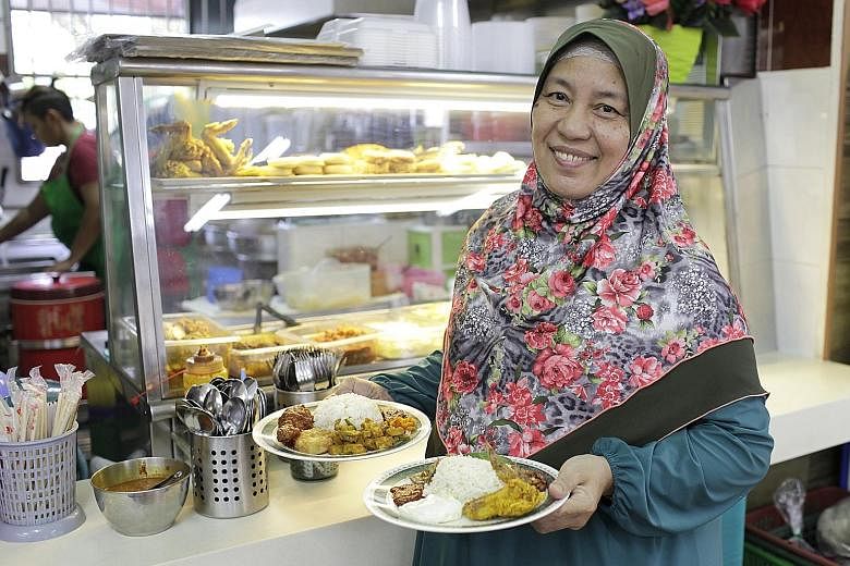 Jumi's Kitchen owner Yunaina Taib (left) uses a mix of white, basmati and brown rice in some dishes at her stall. Healthy Carbs' chef Ang Seng Guan with the stall's two brown rice dishes - saba fish with brown rice (left) and teriyaki chicken with br