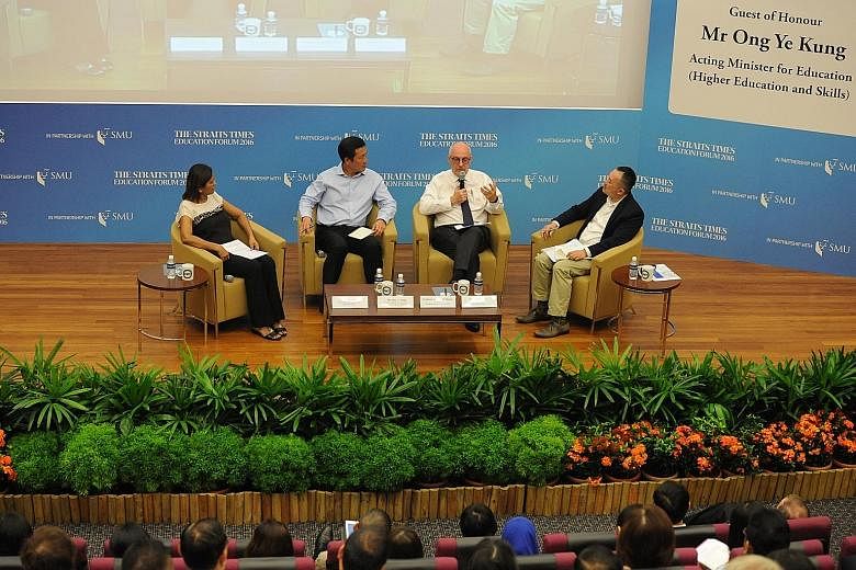 (From left in photo) ST senior education correspondent Sandra Davie, Acting Education Minister (Higher Education and Skills) Ong Ye Kung, SMU president Arnoud De Meyer and ST deputy editor Ignatius Low engaging in a lively discussion with the audienc