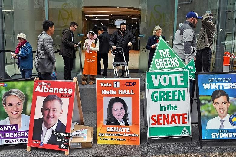 A polling station in Sydney. Australians not able to vote on Saturday got to cast their ballots early yesterday. The ruling Coalition is using the Brexit vote to warn against voting for the opposition Labor in the general election, as a poll shows th
