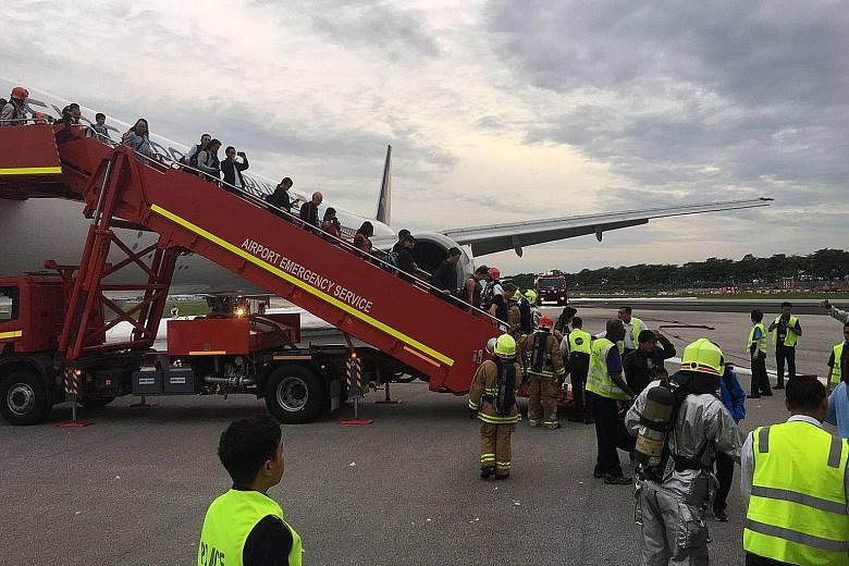 It took about five minutes for the fire on Flight SQ368's right wing to be put out, during which time passengers were kept on board. They were allowed to leave only after firefighters had put out the blaze.