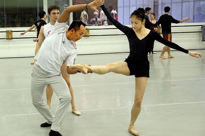 Ma Cong (left), choreographer of two pieces for Ballet Under The Stars, in a rehearsal.