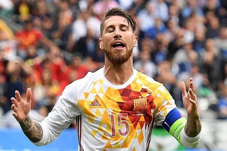 Spain's fall from grace is marked by the anguish of Sergio Ramos, a member of the last two triumphant Spanish Euro teams. Graziano Pelle volleying past Spain goalkeeper David de Gea to seal Italy's 2-0 win, turning the tide between the two sides. The