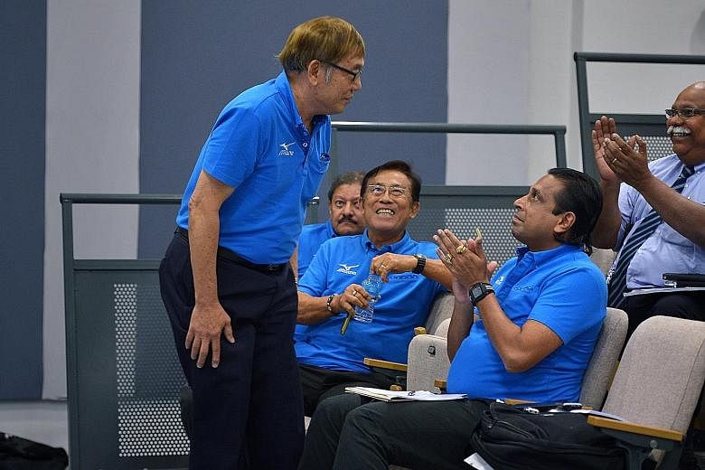 Singapore Athletics president Ho Mun Cheong (standing) and his committee members Govindasamy Balasekaran and Loh Chan Pew have acknowledged the challenge ahead to deliver more success.