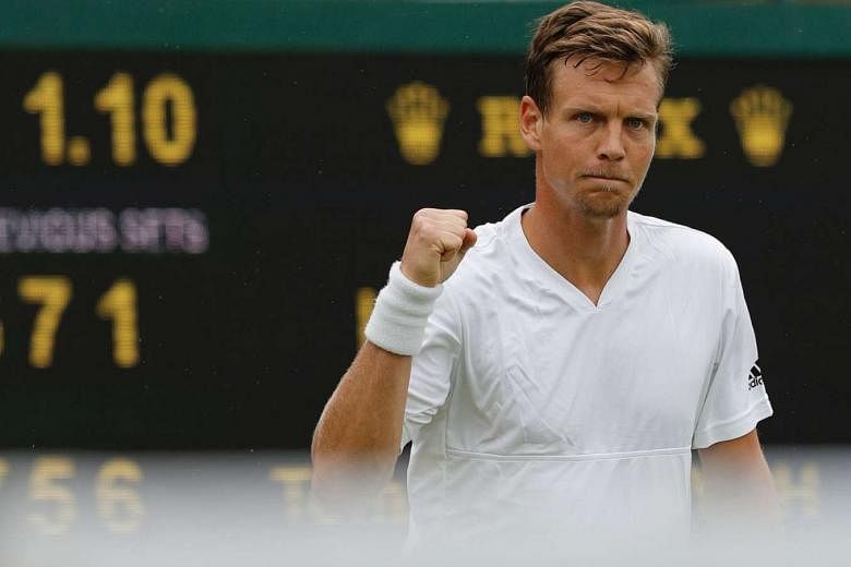 Tomas Berdych of the Czech Republic showing his relief after clinching a two-day, four-set victory against Ivan Dodig of Croatia yesterday. Berdych, runner-up to Rafael Nadal at Wimbledon in 2010, beat Dodig 7-6 (7-5), 5-7, 6-1, 7-6 (7-2) as rain disrupte