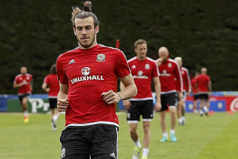 A relaxed and confident Gareth Bale during a Wales training session. His team-mates are no slouches but he will no doubt be their danger man again. The convivial atmosphere of the Wales camp and low-key build-up to big games are the perfect tonic for