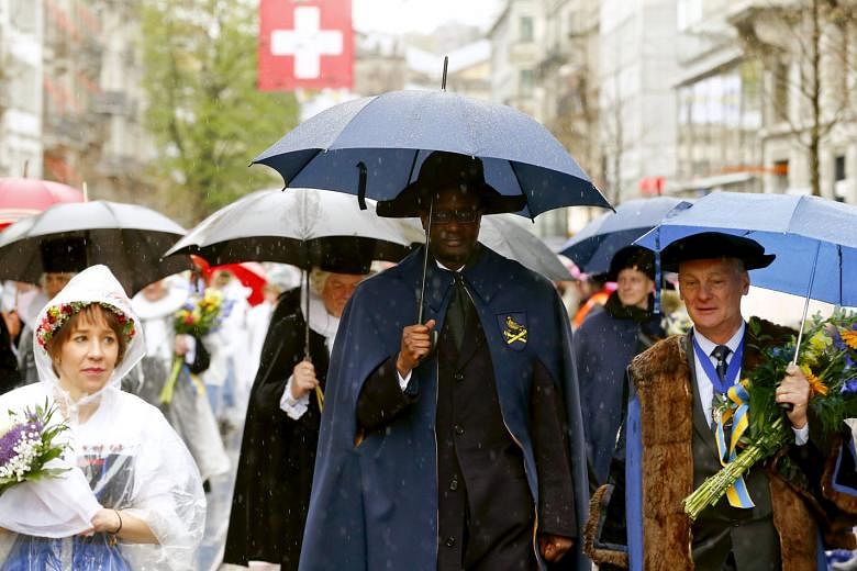 Mr Thiam (above) taking part in a parade to mark the start of spring in Zurich in April. He says his bank is in a good position to deal with the fallout of Brexit because it has already been paring its operations in London. 