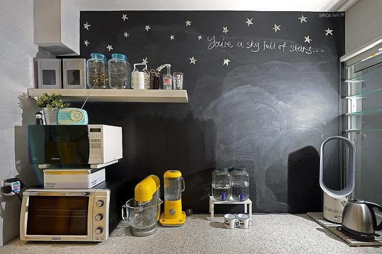 The chalkboard wall (above) in the kitchen is painted by home owner Muhammad Hamsani Hashim.