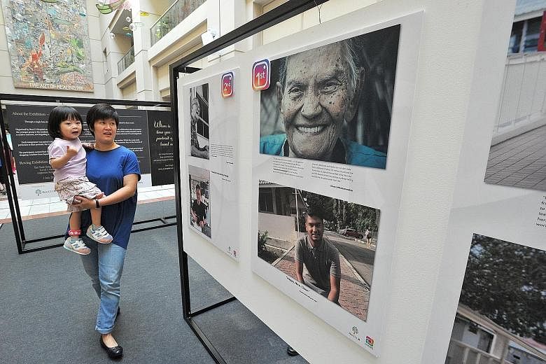 The winning photo entries of Aunty Mani and Mr Gowreesan on display at the atrium of Tan Tock Seng Hospital, along with 14 other entries from Ren Ci Nursing Home residents. The photos are part of the 1 Lens, 2 Photos, 3 Words exhibition launched yest