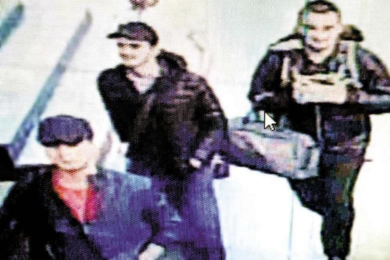 In this screengrab from CCTV video footage, the three men believed to be the attackers are seen walking in Istanbul's Ataturk Airport on Tuesday dressed in heavy clothing much too warm for summer.