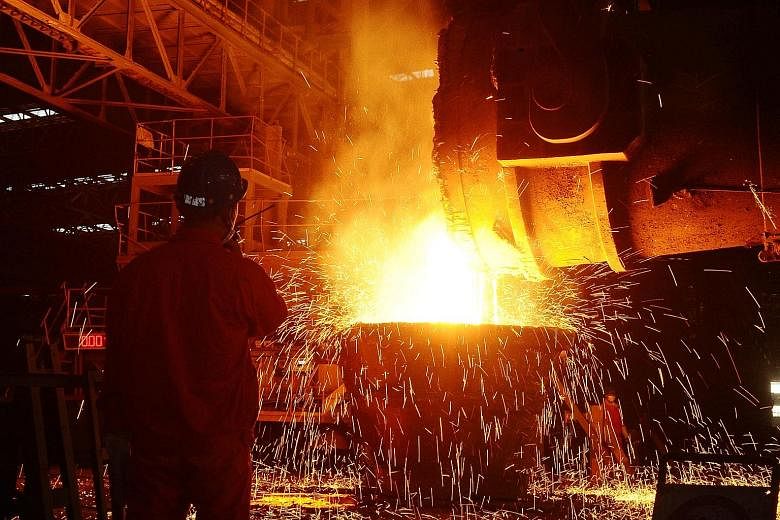 An employee working at a steel factory in Dalian, Liaoning Province. China's PMI ticked down to the 50 mark, which separates contraction from expansion.