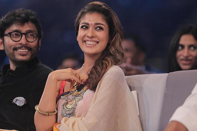 Nayanthara won Best Actress for both the Tamil and Malayalam film categories. Beside her is RJ Balaji, who won Best Comedian (Tamil).