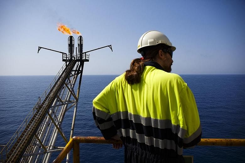 An oil platform off the coast of Spain. Oil prices plunged to a 12-year low of US$27.88 per barrel in January before recovering to US$50 in June. The disruptions in the supply chain, for example through the Canadian forest fires, have reduced supply,