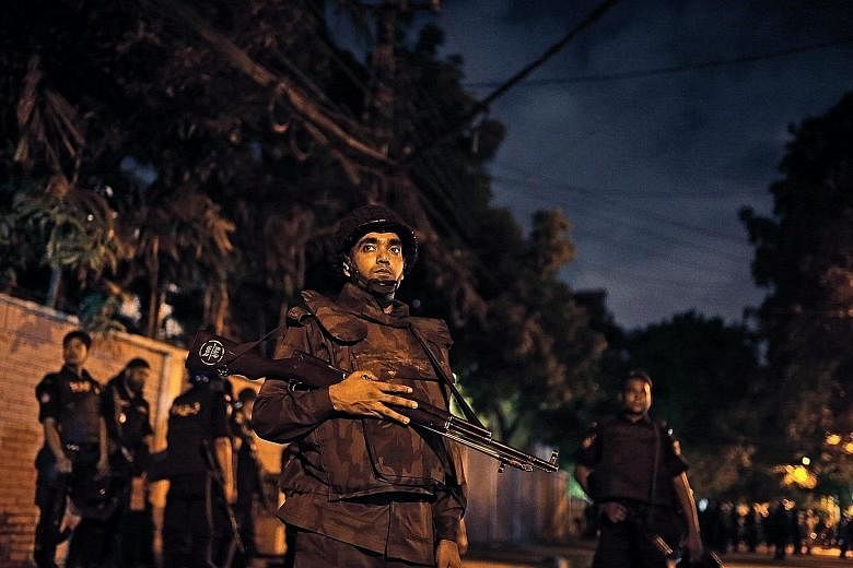 Security forces standing guard on Friday as they sealed off streets near the cafe in an upscale Dhaka neighbourhood where gunmen were holding people hostage.
