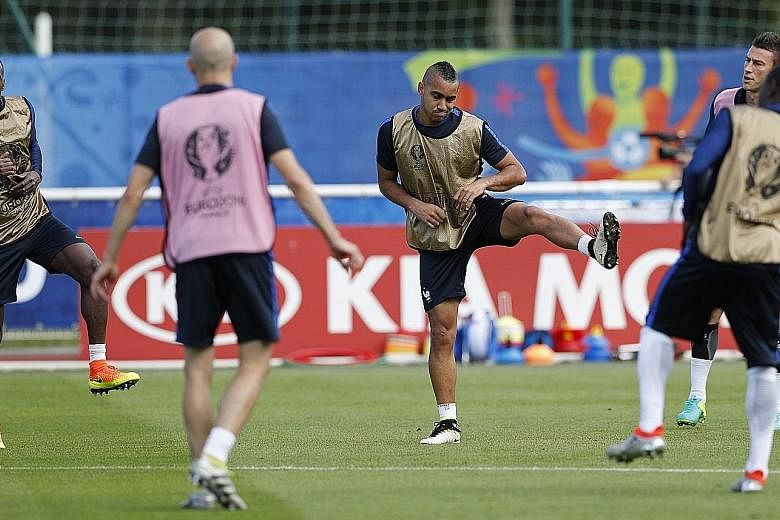 France midfielder Dimitri Payet (centre) training with his team-mates before the quarter-final clash with Iceland. All Les Bleus' four victories at this tournament have been secured late.