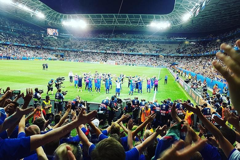 Iceland fans celebrating with their players by doing the war cry, after Monday's 2-1 victory over England in the round of 16.