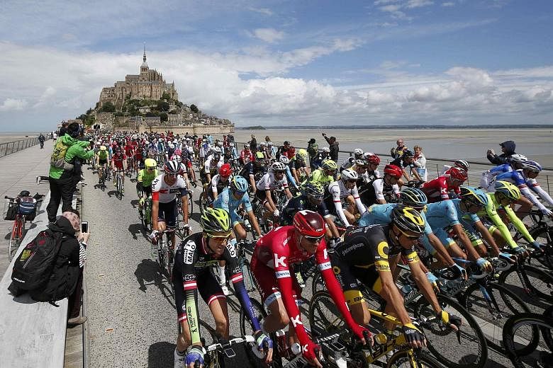 The start of the Tour de France cycling race at Mont Saint-Michel, Normandy, yesterday. Britain's Mark Cavendish closed in on the all-time record by winning the opening 188km stage at Utah Beach. The 31-year-old's 27th stage win since 2008 puts him j