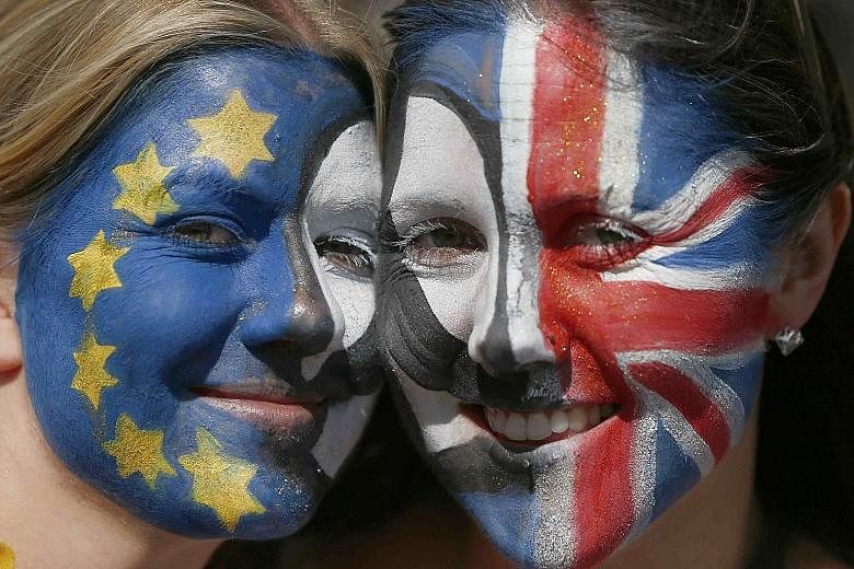 Anti-Brexit protesters with painted faces during the March For Europe demonstration in central London on Saturday.