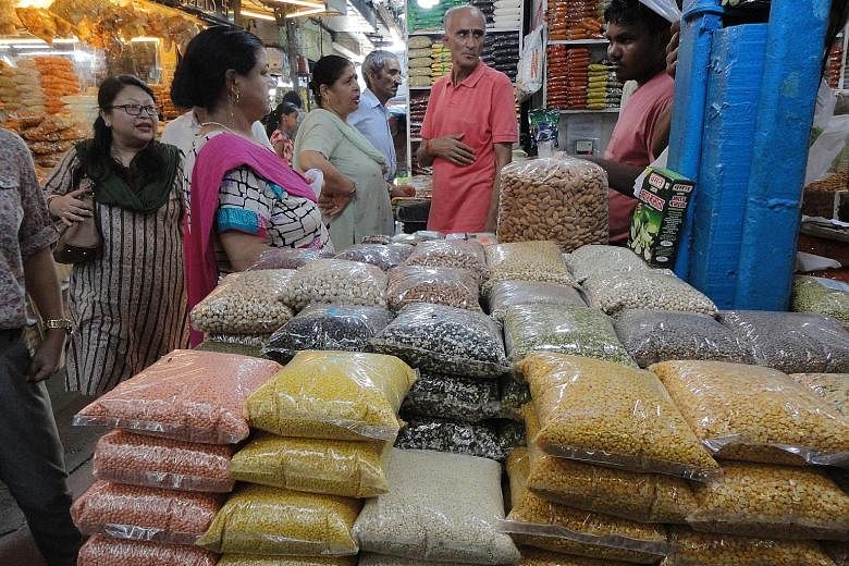 At INA market, a food bazaar in Delhi, the sale of lentils in some of the shops has been slow in recent weeks.