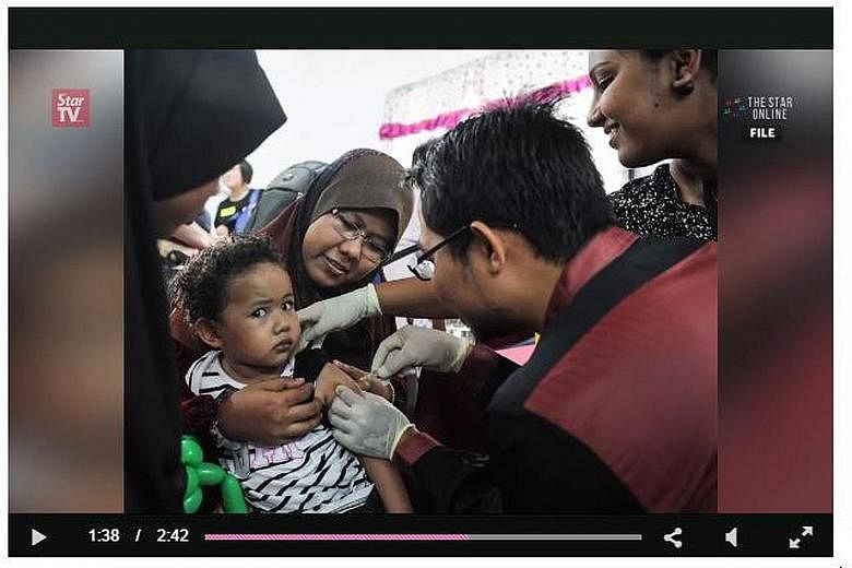 Unlike this child, many young boys and girls in Malaysia are not getting vaccinated because their parents are afraid of what these vaccines may contain as well as possible side effects.