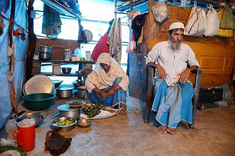 Rohingya Muslim Mohammed Noor and his wife in their tent in a refugee camp in Telangana, south India. More than 1,200 Rohingya fleeing sectarian violence in Myanmar have settled there.