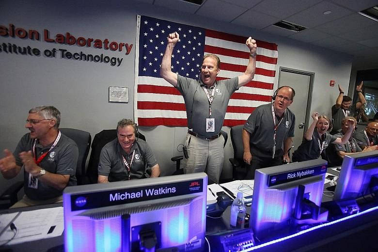 Nasa scientists behind the Juno project cheering as the solar-powered spacecraft went into orbit around Jupiter yesterday. It has taken five years for Juno to travel this far, and its inaugural lap around the solar system's most massive planet will l