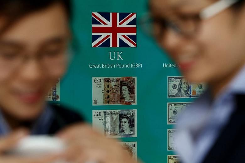 The Union Jack and British pound banknotes on display outside a bank in the South Korean capital Seoul. South Korea last week unveiled an US$8.5 billion (S$11.4 billion) economic support package to weather the Brexit shock, giving the central bank room to