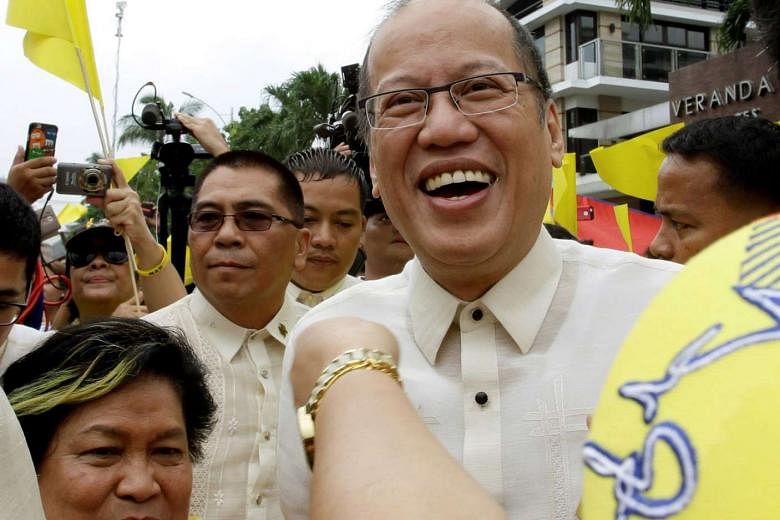 Former Philippine president Benigno Aquino is all smiles as he is welcomed by supporters upon arrival at his private residence in metro Manila last Thursday. In his quest for economic growth, he overlooked the masses who gained little from the country's g