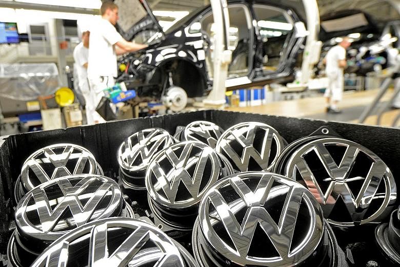 Emblems of the Volkswagen Golf VII car in a production line at a plant in Wolfsburg, Germany. Some 11 million Volkswagen vehicles worldwide were affected by the emissions scandal that broke in October last year.