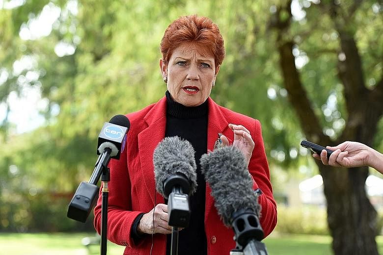 Ms Pauline Hanson speaking during a news conference in Brisbane on Monday. In this election, she has focused her attacks on Muslims, but she has not renounced her claims that Australia needs to limit Asian migration.