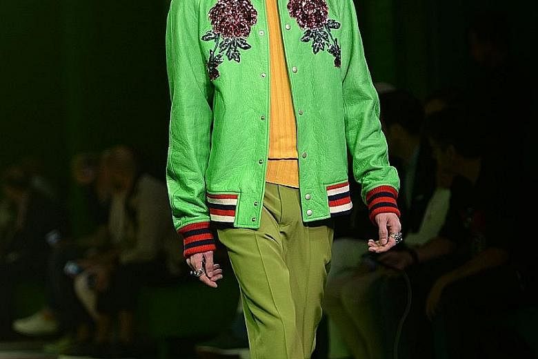Gucci's signature flower motif on a jacket shown at the men's spring/summer 2017 fashion show in Milan, Italy, last month. A service at the label's flagship store in Milan allows customisation of jackets, tuxedos, coats and shoes.