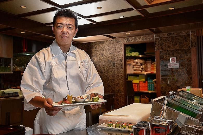 Sabar's managing director Okada Ryo plans to open three more outlets here for the brand which specialises in saba or mackerel (far right).