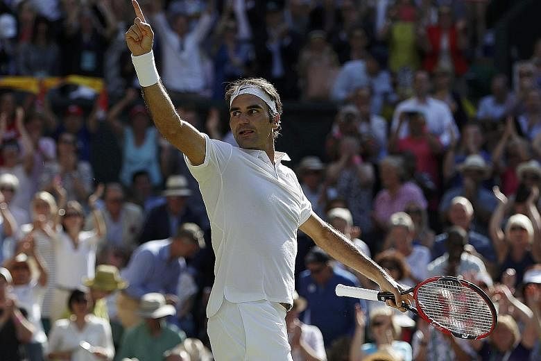 Swiss legend Roger Federer saluting the Wimbledon crowd after recovering from near defeat to beat Croatia's Marin Cilic in five sets in the quarter-finals.